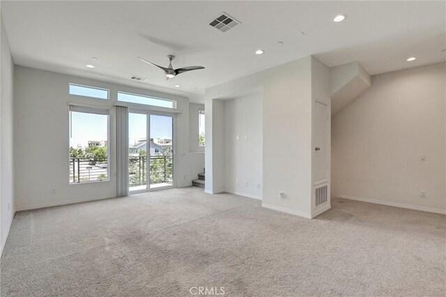 104 Keeper, Irvine, CA 92618 - spare room featuring light colored carpet, ceiling fan, stairs, and recessed lighting