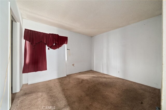 312 W 234th Pl, Carson, CA 90745 - spare room featuring carpet floors and a textured ceiling