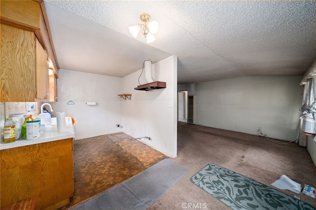 312 W 234th Pl, Carson, CA 90745 - kitchen with carpet flooring, a textured ceiling, and brown cabinetry