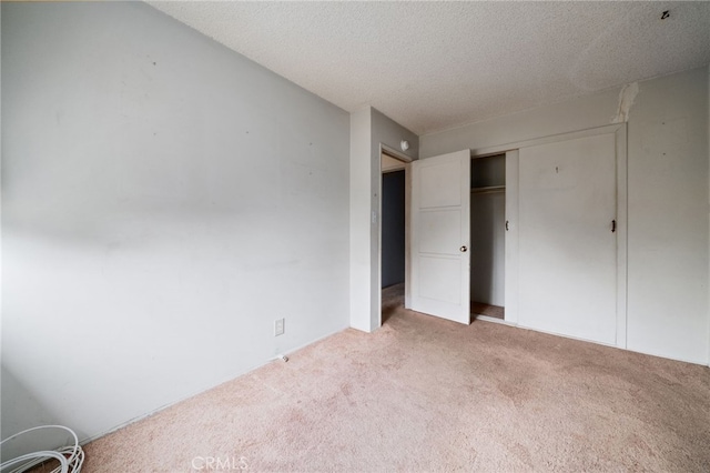 312 W 234th Pl, Carson, CA 90745 - unfurnished bedroom featuring carpet flooring, a closet, and a textured ceiling