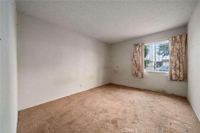 312 W 234th Pl, Carson, CA 90745 - empty room with carpet flooring and a textured ceiling