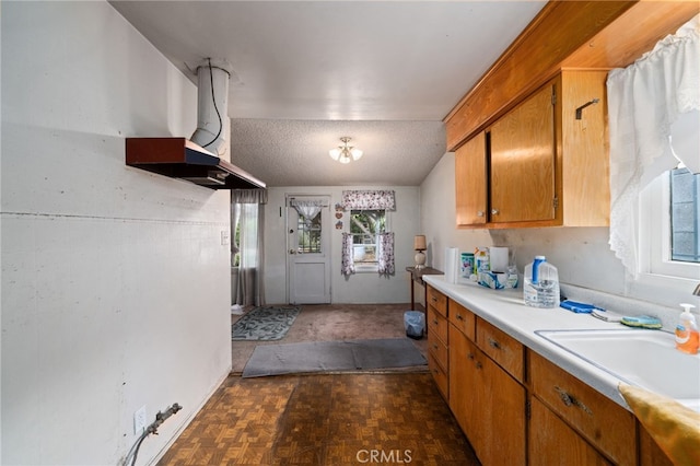 312 W 234th Pl, Carson, CA 90745 - kitchen featuring light countertops and brown cabinets