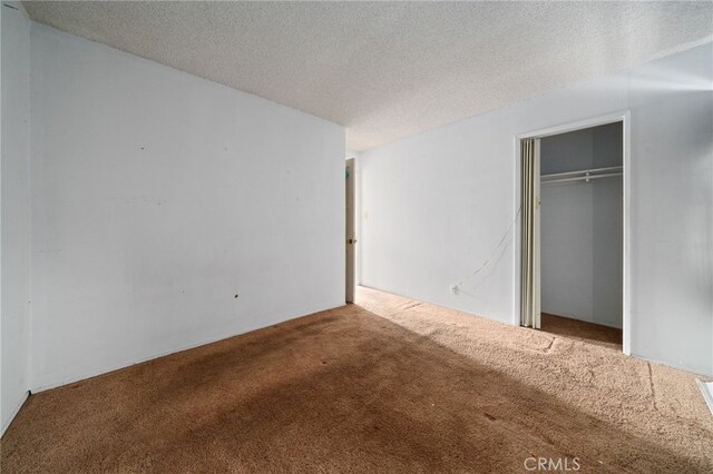 312 W 234th Pl, Carson, CA 90745 - unfurnished bedroom with carpet floors, a closet, and a textured ceiling