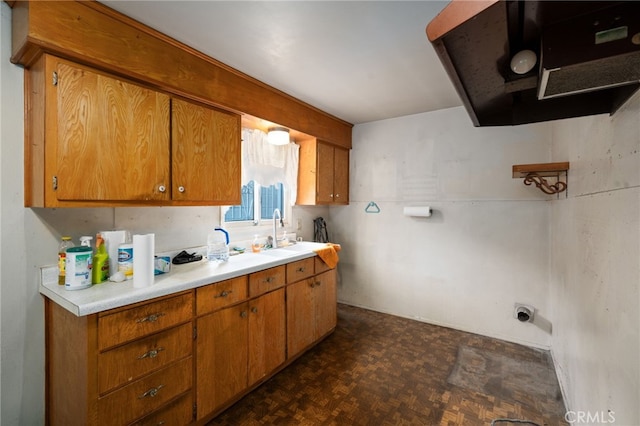 312 W 234th Pl, Carson, CA 90745 - kitchen featuring brown cabinets, light countertops, and extractor fan
