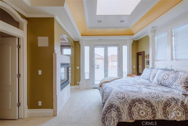 325 Juanita Ave, Oceano, CA 93445 - carpeted bedroom with ornamental molding, access to outside, french doors, a skylight, and a glass covered fireplace