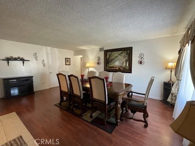 7430 Leucite Ave, Rancho Cucamonga, CA 91730 - dining room with a textured ceiling and wood finished floors