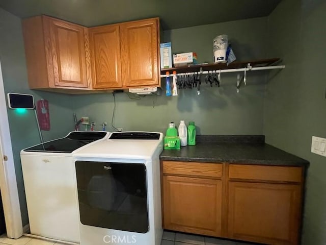 7430 Leucite Ave, Rancho Cucamonga, CA 91730 - washroom featuring cabinet space, washing machine and clothes dryer, and light tile patterned floors