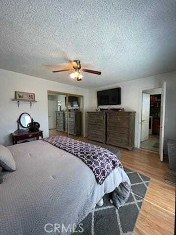 7430 Leucite Ave, Rancho Cucamonga, CA 91730 - bedroom featuring a textured ceiling, wood finished floors, and a ceiling fan