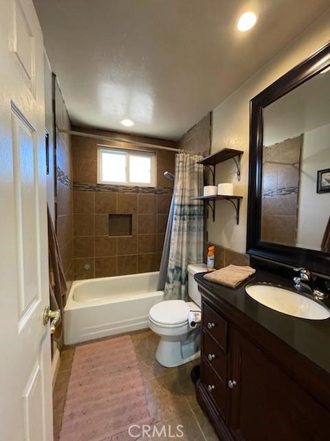 7430 Leucite Ave, Rancho Cucamonga, CA 91730 - full bath with tile patterned floors, vanity, shower / bath combo, and recessed lighting