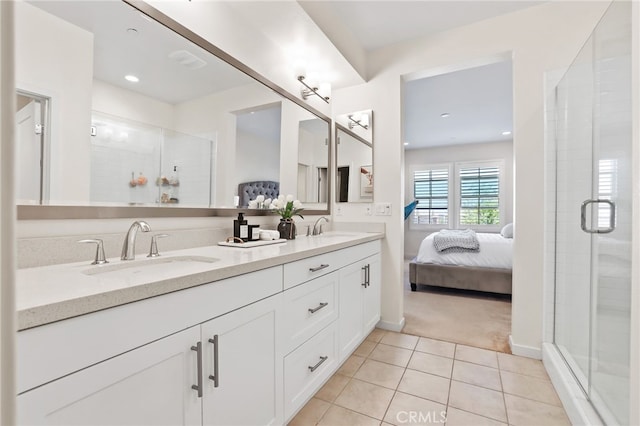 105 High Mdw, Lake Forest, CA 92610 - ensuite bathroom featuring double vanity, a stall shower, tile patterned floors, and recessed lighting