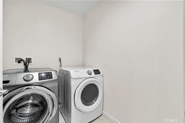 105 High Mdw, Lake Forest, CA 92610 - washroom featuring washer and clothes dryer and baseboards