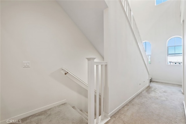 105 High Mdw, Lake Forest, CA 92610 - staircase with carpet floors and a towering ceiling