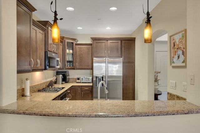 13200 Moorpark St Unit 201, Sherman Oaks, CA 91423 - kitchen featuring appliances with stainless steel finishes, glass insert cabinets, light stone countertops, recessed lighting, and hanging light fixtures