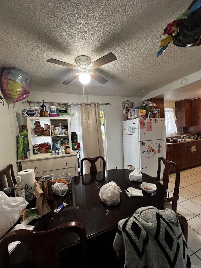 4139 46th St, San Diego, CA 92105 - dining room with light tile patterned flooring, a ceiling fan, and a textured ceiling