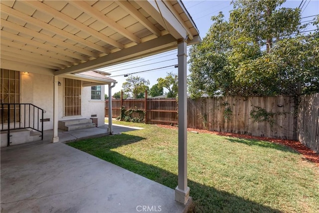 3766 Rose Ave, Long Beach, CA 90807 - fenced backyard with a patio area and entry steps