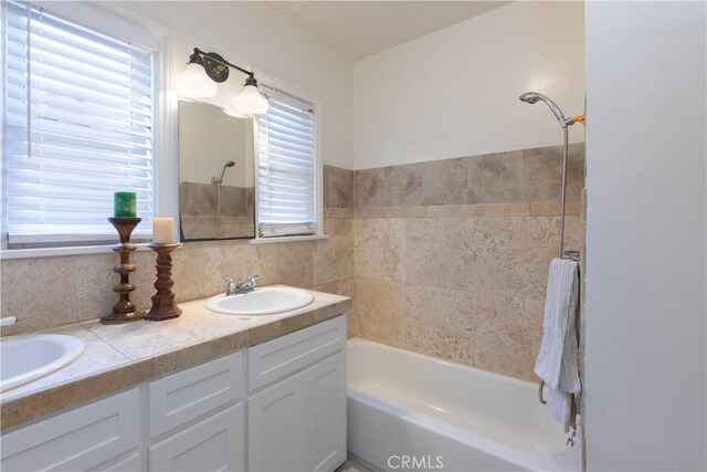 3766 Rose Ave, Long Beach, CA 90807 - bathroom with double vanity, shower / bath combination, and backsplash