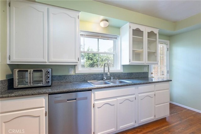 3766 Rose Ave, Long Beach, CA 90807 - kitchen featuring stainless steel dishwasher, white cabinetry, dark wood-style flooring, glass insert cabinets, and dark countertops
