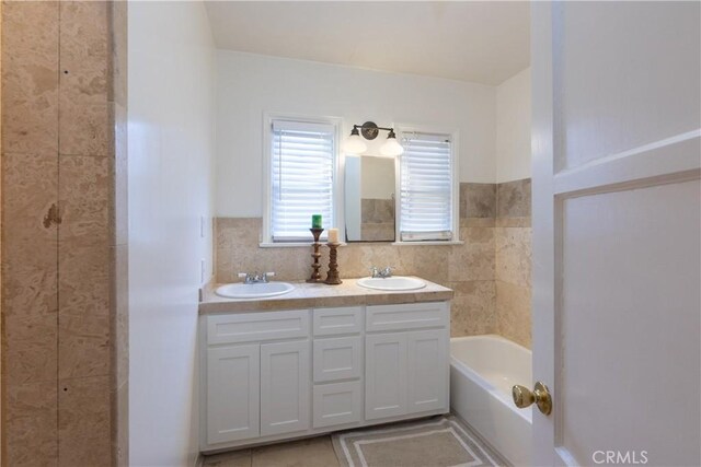 3766 Rose Ave, Long Beach, CA 90807 - full bathroom featuring double vanity and a bathtub