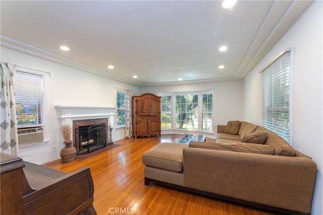 3766 Rose Ave, Long Beach, CA 90807 - living area featuring light wood-style floors, cooling unit, a brick fireplace, crown molding, and recessed lighting