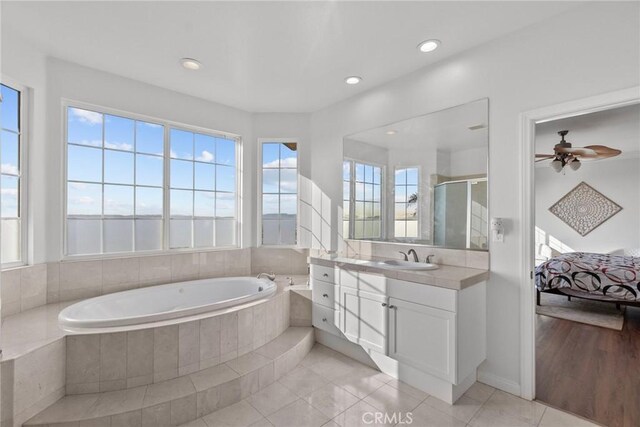 20704 Campania Ln, Porter Ranch, CA 91326 - full bath with vanity, a garden tub, tile patterned flooring, a shower stall, and ensuite bath