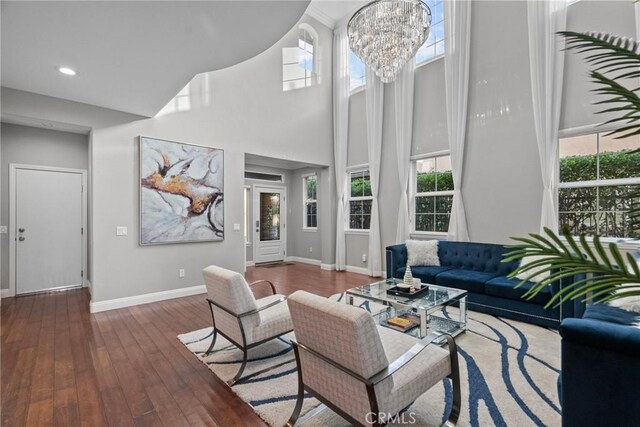 20704 Campania Ln, Porter Ranch, CA 91326 - living area with hardwood / wood-style flooring, a towering ceiling, a chandelier, and recessed lighting