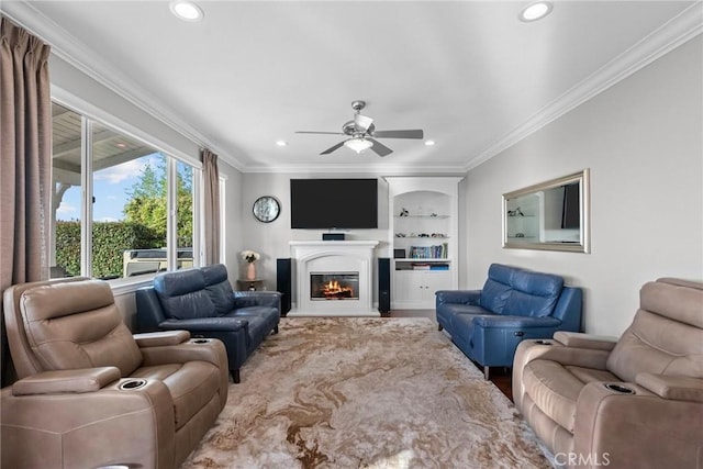 20704 Campania Ln, Porter Ranch, CA 91326 - living room featuring a ceiling fan, ornamental molding, built in features, recessed lighting, and a glass covered fireplace