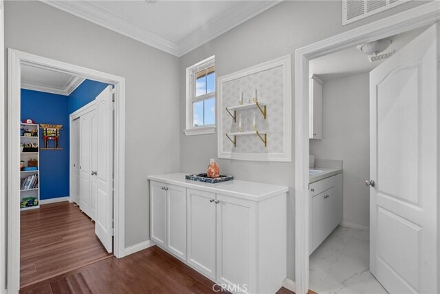 20704 Campania Ln, Porter Ranch, CA 91326 - hall featuring crown molding and dark wood-style floors