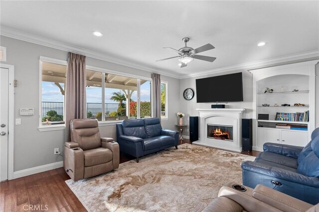 20704 Campania Ln, Porter Ranch, CA 91326 - living room featuring crown molding, a ceiling fan, hardwood / wood-style flooring, a glass covered fireplace, and recessed lighting