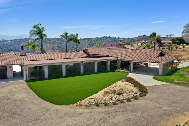 36485 Carney Rd, Valley Center, CA 92082 - view of front facade featuring a tiled roof, a chimney, a mountain view, and a front lawn
