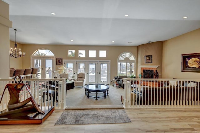 36485 Carney Rd, Valley Center, CA 92082 - living room with french doors, healthy amount of natural light, recessed lighting, wood finished floors, and a fireplace