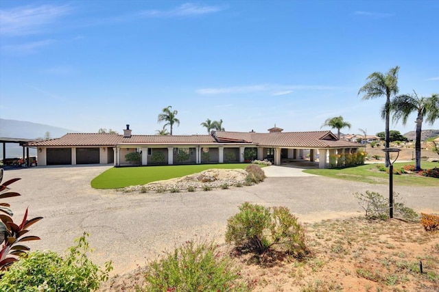 36485 Carney Rd, Valley Center, CA 92082 - ranch-style home with a tile roof, an attached garage, a chimney, driveway, and stucco siding