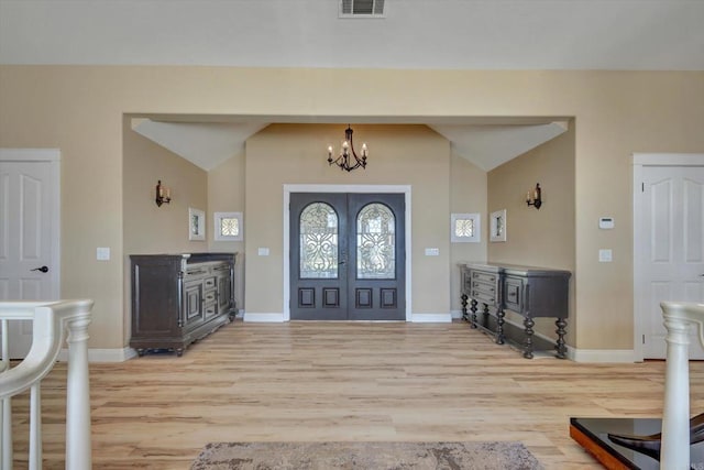 36485 Carney Rd, Valley Center, CA 92082 - entryway with light wood-style floors, vaulted ceiling, a chandelier, and french doors
