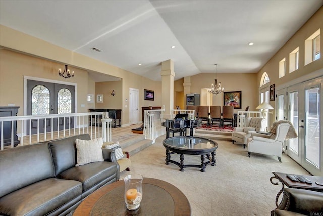 36485 Carney Rd, Valley Center, CA 92082 - living room with a chandelier, french doors, lofted ceiling, light carpet, and decorative columns