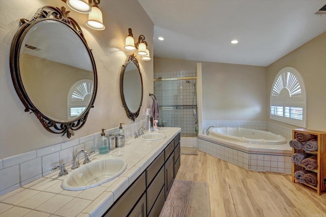 36485 Carney Rd, Valley Center, CA 92082 - full bath featuring wood finished floors, double vanity, a bath, a tile shower, and recessed lighting