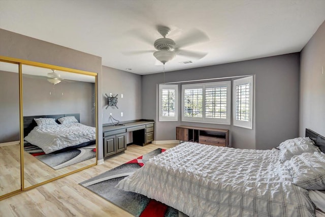 36485 Carney Rd, Valley Center, CA 92082 - bedroom with light wood-style floors, a closet, and a ceiling fan