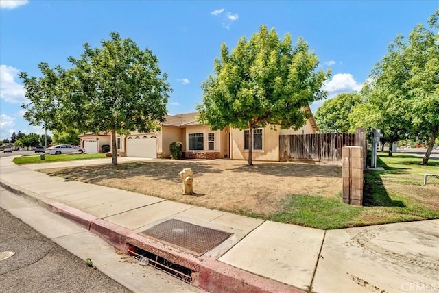 2508 Goldridge St, Selma, CA 93662 - view of front of property featuring stucco siding, an attached garage, and concrete driveway