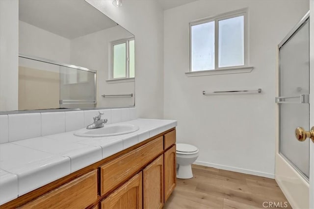 2508 Goldridge St, Selma, CA 93662 - bathroom featuring vanity, wood finished floors, and enclosed tub / shower combo