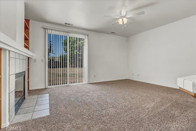 2508 Goldridge St, Selma, CA 93662 - unfurnished living room featuring light colored carpet, ceiling fan, and a tiled fireplace