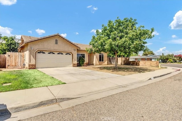 2508 Goldridge St, Selma, CA 93662 - ranch-style house with a garage, stucco siding, and concrete driveway