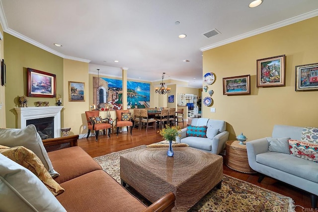 2744 Carlsbad Blvd Unit 204, Carlsbad, CA 92008 - living area featuring crown molding, a chandelier, wood finished floors, recessed lighting, and a fireplace