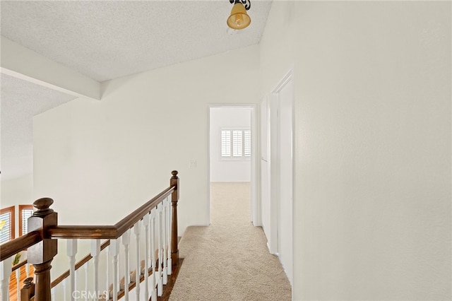 45857 Jeronimo St, Temecula, CA 92592 - hall with an upstairs landing, carpet floors, a textured ceiling, and vaulted ceiling
