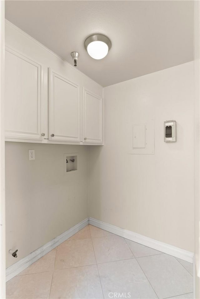 2175 Pacific Ave Unit E4, Costa Mesa, CA 92627 - laundry area with cabinet space, hookup for a washing machine, and light tile patterned floors