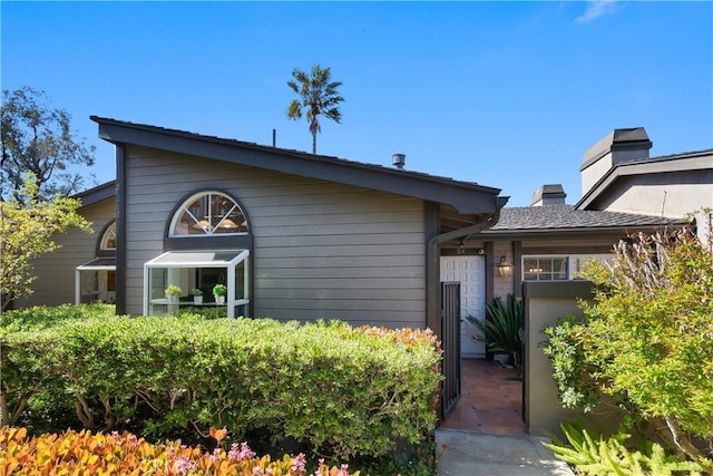 2175 Pacific Ave Unit E4, Costa Mesa, CA 92627 - view of front facade featuring a chimney