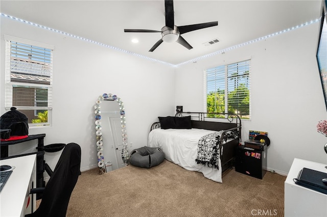 1568 Patterson Ranch Rd, Redlands, CA 92374 - carpeted bedroom with multiple windows, a desk, and ceiling fan