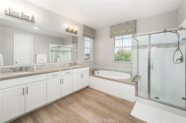 1568 Patterson Ranch Rd, Redlands, CA 92374 - bathroom with a shower stall, double vanity, a garden tub, and wood finished floors