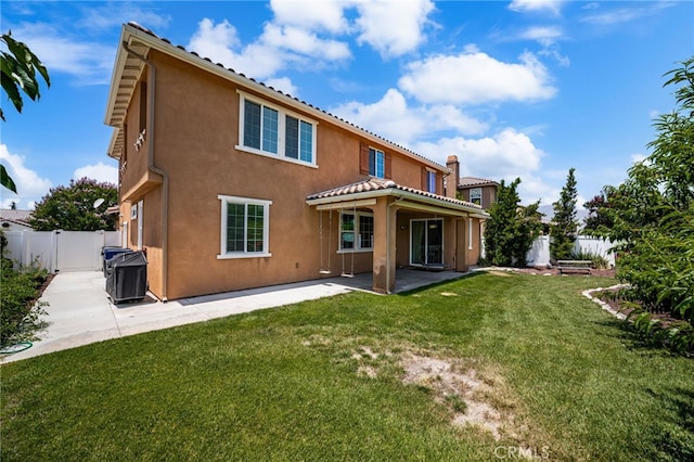 1568 Patterson Ranch Rd, Redlands, CA 92374 - rear view of house featuring stucco siding, a patio area, a fenced backyard, and a gate