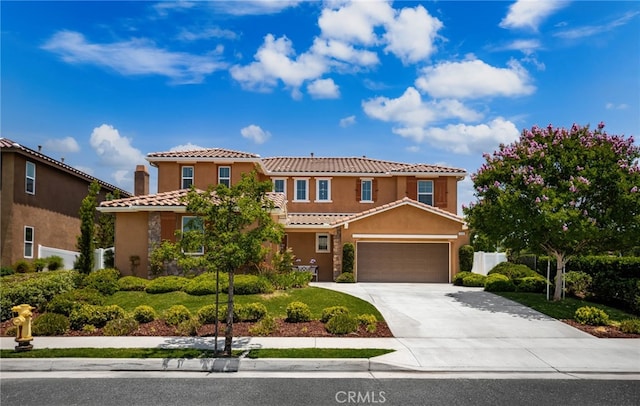 1568 Patterson Ranch Rd, Redlands, CA 92374 - mediterranean / spanish-style home with stucco siding, driveway, and a tile roof