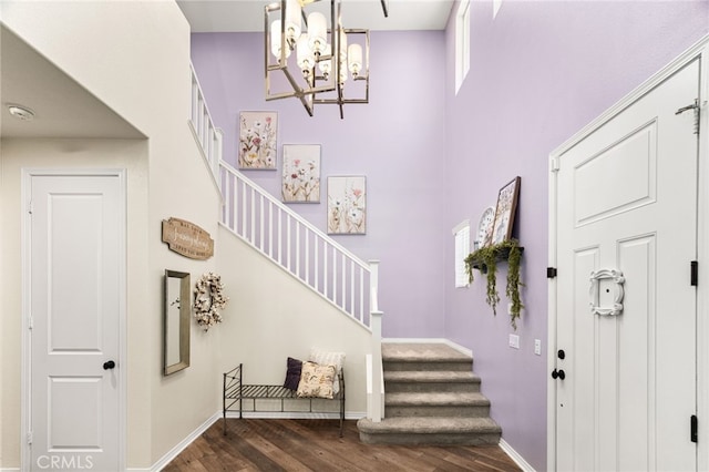 1568 Patterson Ranch Rd, Redlands, CA 92374 - entryway featuring wood finished floors, stairs, a chandelier, and a towering ceiling