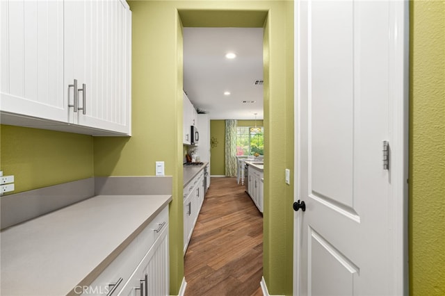 1568 Patterson Ranch Rd, Redlands, CA 92374 - corridor with wood finished floors and recessed lighting