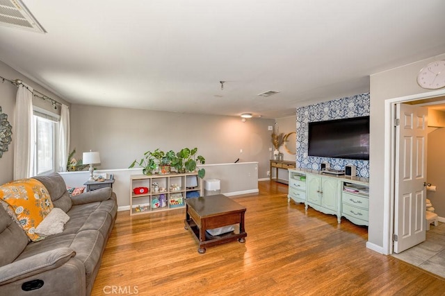 1134 N Rowan Ave, East Los Angeles, CA 90063 - living area with light wood-type flooring and baseboards